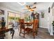 Bright dining room with wood table and access to backyard patio at 15489 N Ridgeview Rd, Sun City, AZ 85351