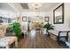 Bright and airy entryway with hardwood floors and decorative bench at 15489 N Ridgeview Rd, Sun City, AZ 85351