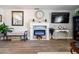 Modern fireplace with white mantel and decorative accents at 15489 N Ridgeview Rd, Sun City, AZ 85351