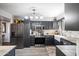 Modern kitchen with dark cabinets and stainless steel appliances at 15489 N Ridgeview Rd, Sun City, AZ 85351