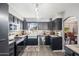 Modern kitchen with stainless steel appliances and a farmhouse sink at 15489 N Ridgeview Rd, Sun City, AZ 85351