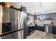 Modern kitchen with stainless steel appliances and dark cabinetry at 15489 N Ridgeview Rd, Sun City, AZ 85351