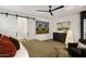 Main bedroom with large artwork and sliding barn door at 15577 S 181St Ln, Goodyear, AZ 85338