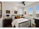 Cozy bedroom with metal bed frame and window seating at 15577 S 181St Ln, Goodyear, AZ 85338