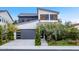 Modern two-story home with gray garage door and landscaping at 15577 S 181St Ln, Goodyear, AZ 85338