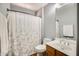 Cozy bathroom featuring a shower with curtain, a toilet and a single sink vanity at 16625 N Agate Knoll Pl, Fountain Hills, AZ 85268