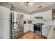 Well-lit kitchen featuring stainless steel appliances, white cabinets, and a modern design at 16625 N Agate Knoll Pl, Fountain Hills, AZ 85268