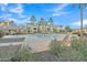 Relaxing community pool with lounge chairs and landscaping at 1671 E Dogwood Ln, Gilbert, AZ 85295