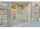 Covered entryway with stone facade and lantern at 1671 E Dogwood Ln, Gilbert, AZ 85295