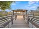 Community gazebo with wooden deck and lake views at 1671 E Dogwood Ln, Gilbert, AZ 85295