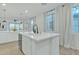 Modern kitchen with large island and window at 1671 E Dogwood Ln, Gilbert, AZ 85295