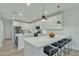 Modern kitchen with white cabinets and island at 1671 E Dogwood Ln, Gilbert, AZ 85295