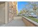 Stone patio with sitting area and view of neighborhood at 1671 E Dogwood Ln, Gilbert, AZ 85295