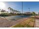 Outdoor basketball court with palm trees in the background at 18187 W Wind Song Ave, Goodyear, AZ 85338