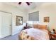 Guest bedroom with a double bed and neutral decor at 18187 W Wind Song Ave, Goodyear, AZ 85338