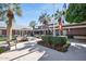 Beautiful clubhouse exterior with manicured gardens, creating a sophisticated and inviting community space at 18187 W Wind Song Ave, Goodyear, AZ 85338