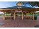 Park gazebo with benches, offering a shaded area at 18187 W Wind Song Ave, Goodyear, AZ 85338