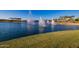 Multiple fountains in a lake, creating a relaxing atmosphere at 18187 W Wind Song Ave, Goodyear, AZ 85338