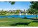 Lake with two fountains and palm trees at 18187 W Wind Song Ave, Goodyear, AZ 85338