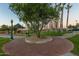 Brick pathway winds through a park with palm trees at 18187 W Wind Song Ave, Goodyear, AZ 85338