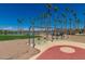 Park swings near a lake and gazebo at 18187 W Wind Song Ave, Goodyear, AZ 85338