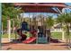 playground with covered structure and slides at 18187 W Wind Song Ave, Goodyear, AZ 85338