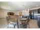 Casual dining area with a wood table and wrought iron chairs at 18439 W Wind Song Ave, Goodyear, AZ 85338