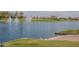 Scenic lake view with ducks and water fountains at 18439 W Wind Song Ave, Goodyear, AZ 85338