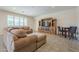 Spacious living room featuring a sectional sofa and built-in entertainment center at 18439 W Wind Song Ave, Goodyear, AZ 85338