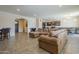 Open floor plan connecting living room and kitchen areas at 18439 W Wind Song Ave, Goodyear, AZ 85338