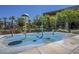 splash pad with colorful water features at 18439 W Wind Song Ave, Goodyear, AZ 85338