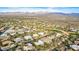 Aerial view of a community with golf course and mountain backdrop at 19007 E Lazo Ct, Rio Verde, AZ 85263