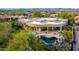 Aerial view showcasing house, pool, and desert landscaping at 19007 E Lazo Ct, Rio Verde, AZ 85263