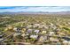 Aerial view showcasing a large community near a golf course and mountains at 19007 E Lazo Ct, Rio Verde, AZ 85263