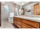 Double vanity bathroom with a large mirror and beige tile flooring at 19007 E Lazo Ct, Rio Verde, AZ 85263