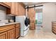 Laundry room with washer, dryer, and ample cabinet space at 19007 E Lazo Ct, Rio Verde, AZ 85263