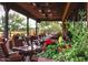 Outdoor patio seating area with lush landscaping and plants at 19007 E Lazo Ct, Rio Verde, AZ 85263