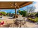 Outdoor patio with seating area and built-in grill at 19007 E Lazo Ct, Rio Verde, AZ 85263