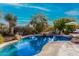 Stunning kidney-shaped pool surrounded by desert landscaping at 19007 E Lazo Ct, Rio Verde, AZ 85263