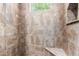 Walk in shower with stone seat and a window for natural light at 19007 E Lazo Ct, Rio Verde, AZ 85263