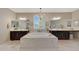 Elegant bathroom with double vanity, large soaking tub, and chandelier at 20744 W Hamilton St, Buckeye, AZ 85396