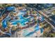 Aerial view of resort-style pool with expansive decks and palm trees at 20744 W Hamilton St, Buckeye, AZ 85396