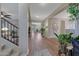 Bright entry hall with hardwood floors, showcasing a staircase and views to the living room at 20744 W Hamilton St, Buckeye, AZ 85396