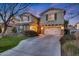 Two-story house with a two car garage and landscaped yard at 20744 W Hamilton St, Buckeye, AZ 85396