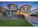 Two-story house with a two-car garage and manicured lawn at 20744 W Hamilton St, Buckeye, AZ 85396