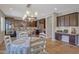 Eat-in kitchen with dark cabinets and a kitchen island at 20744 W Hamilton St, Buckeye, AZ 85396