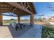 Covered picnic area with tables and benches, adjacent to playground at 20744 W Hamilton St, Buckeye, AZ 85396