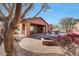 Landscaped backyard with a fire pit and patio area at 20882 W Eastview Way, Buckeye, AZ 85396