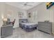 Cozy bedroom with gray dresser and a home office setup at 20882 W Eastview Way, Buckeye, AZ 85396