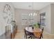 Bright dining room with a charming wooden table and chairs at 20882 W Eastview Way, Buckeye, AZ 85396